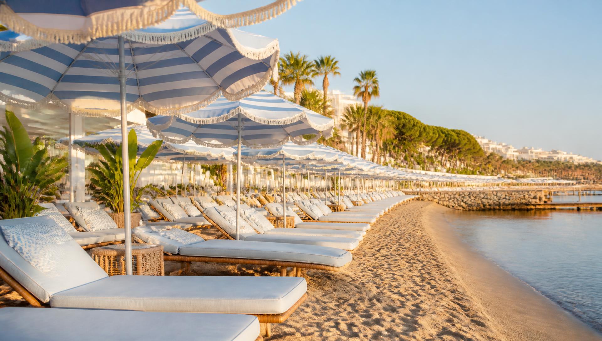 Cannes — Beach club · Striped parasols