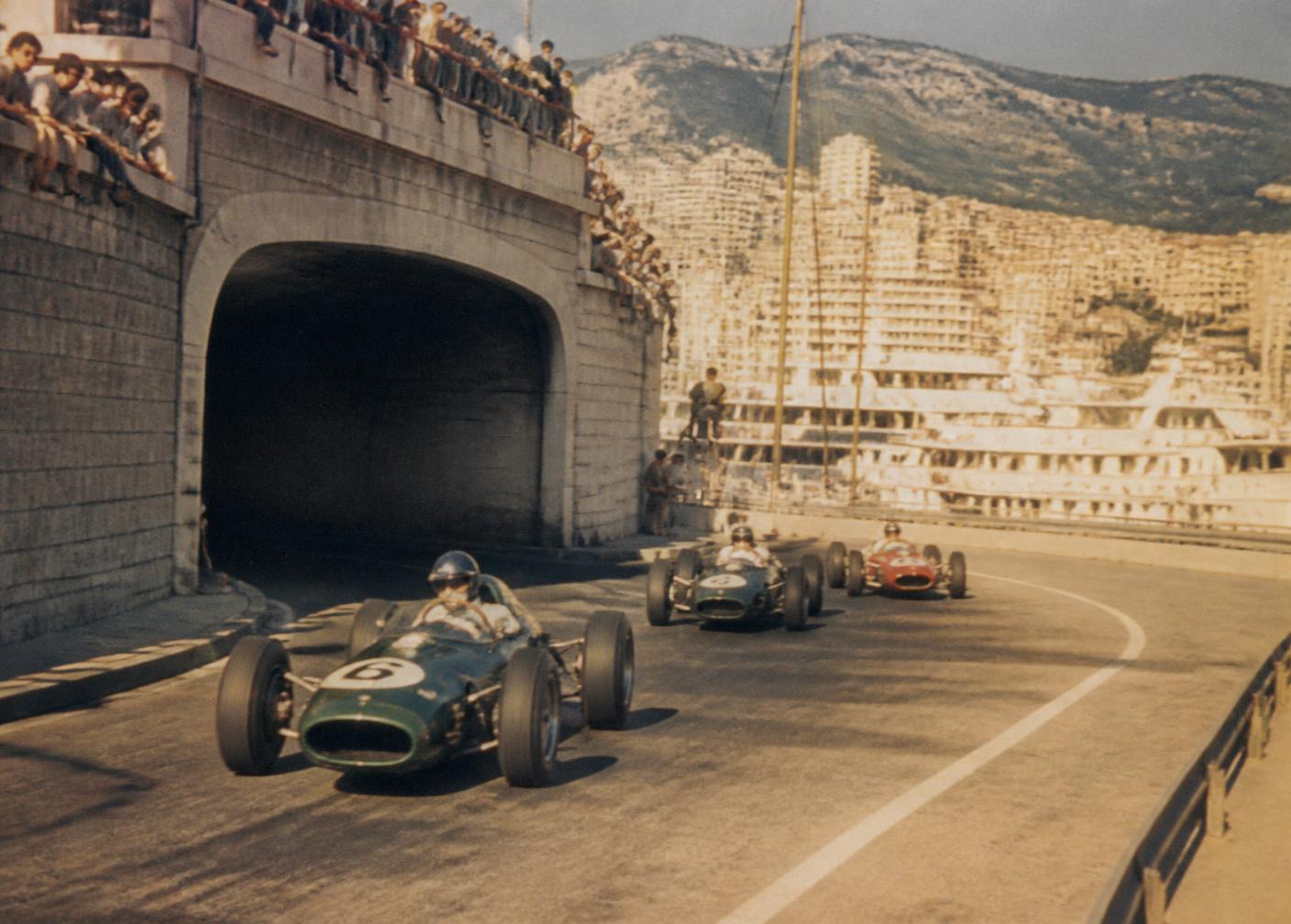 Vintage grand prix car on the streets of Monaco above the harbour